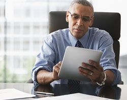 Businessman working on a tablet. 