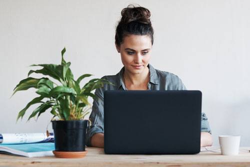 Woman working on her laptop.