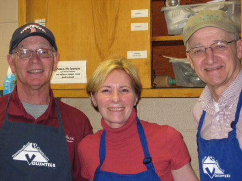 Dennis Zannoni, Theresa Rivera and Rule Loving volunteering at Community Dinner.